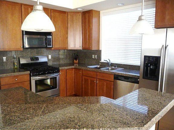 Kitchen with SS, granite and cherry cabinets