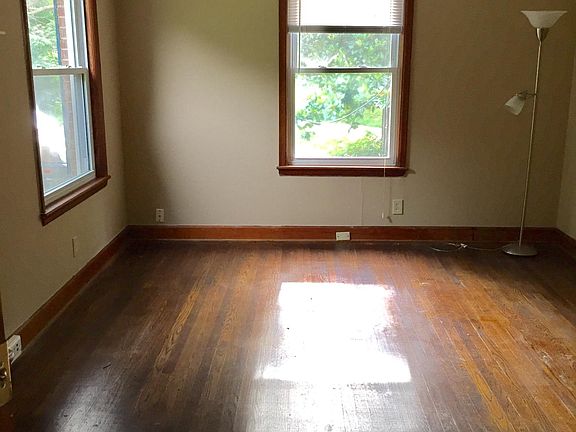 Living room with lots of light and original hardwoods