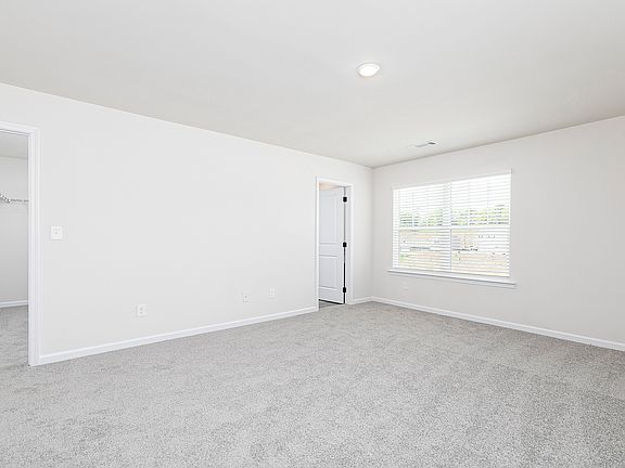 Rest and relaxation await in the master bedroom