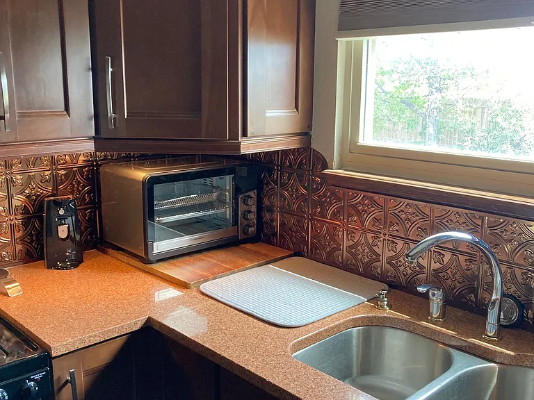 Kitchen B to right of Stove
Dimmable Under Cabinet Lighting
Can Opener and Toaster Oven (+ Air Fry)
Large Double Bowl Deep Sink