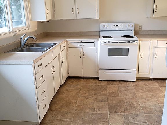 Kitchen with window facing northern side yard