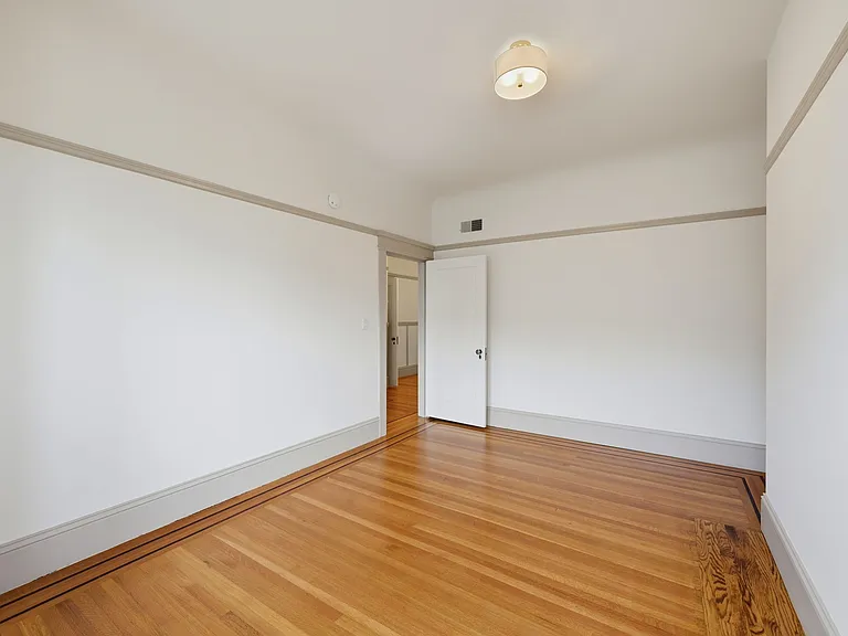 Alternate view of 1st bedroom, from window out to hall