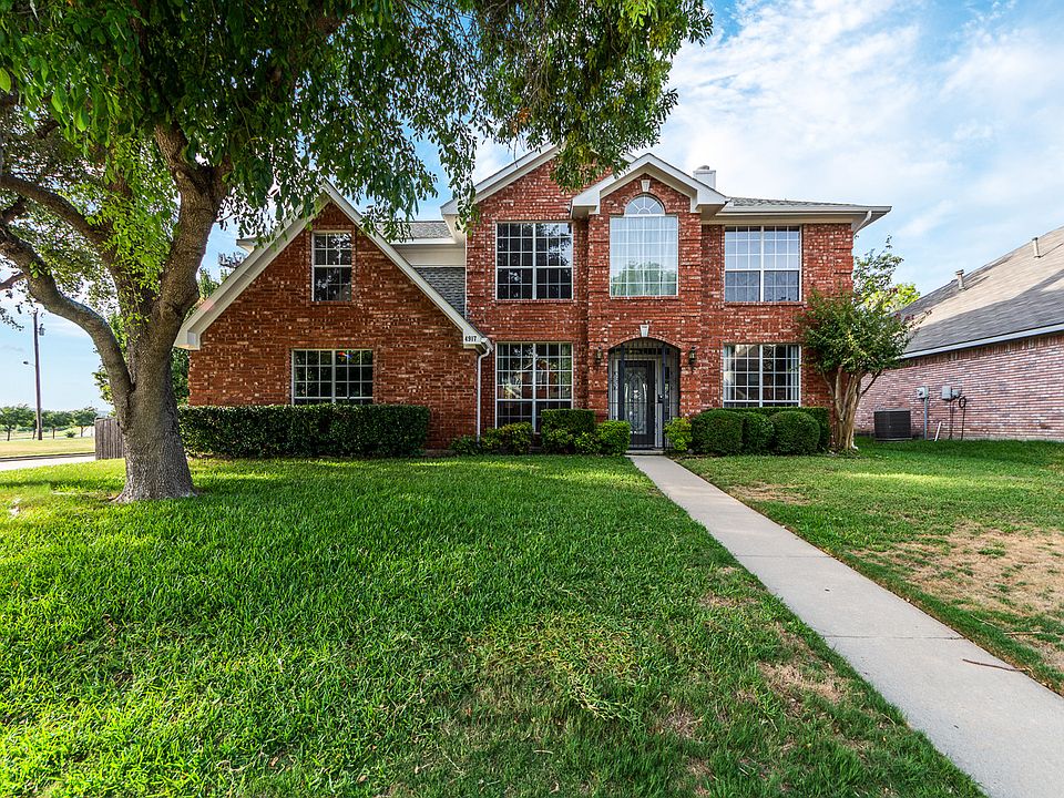 Lawn care is included on the large corner lot!
