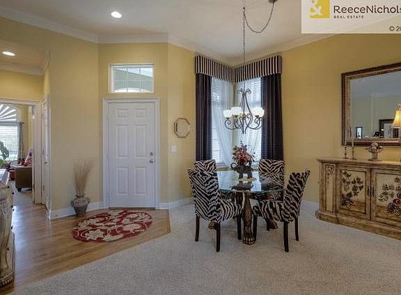 Crown molding and custom drapery in the Formal dining room.Wood