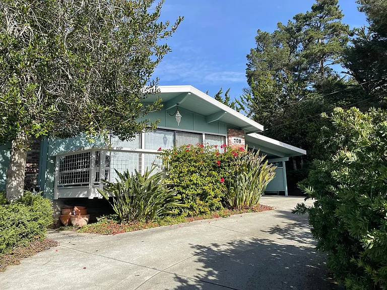 Large driveway fits 2-3 cars, plus carport which fits 1 car