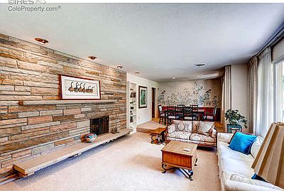 Living room with fireplace and stone surround