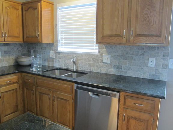 Kitchen - granite & stone backsplash