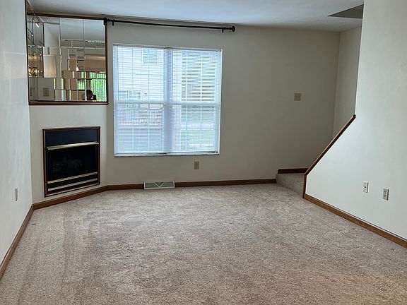 Open living and dining area with gas fireplace