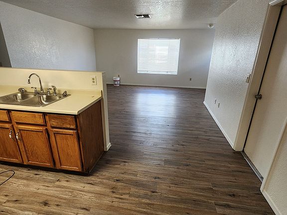 Looking from dining room past kitchen into living room