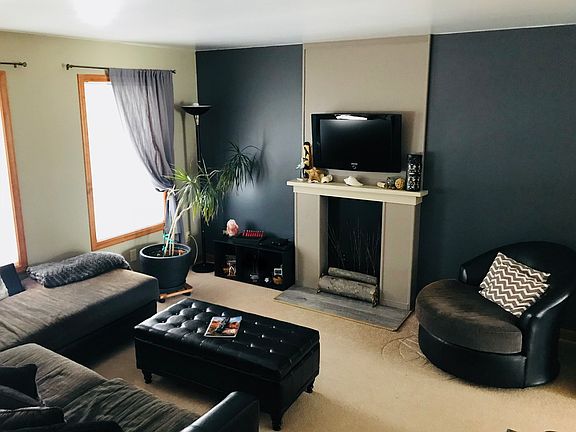 Living room w/faux fireplace