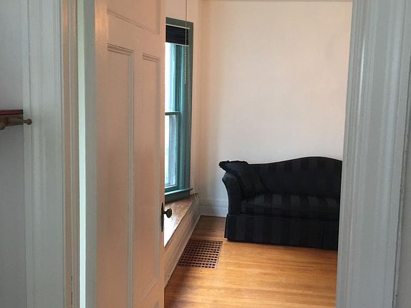Front entryway leading to dining room with bay window.