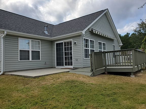 Back deck and patio for grilling with retractable awning.