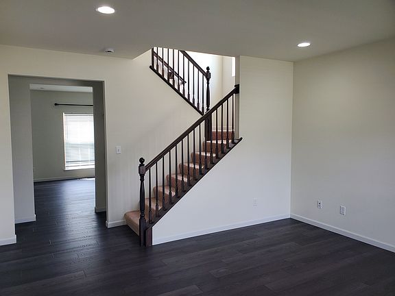 Living with view of the stair case.
