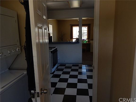 View from back door of front house through laundry room into kitchen