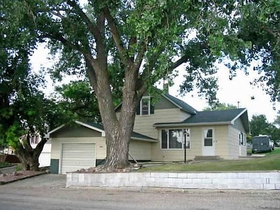 Front of house, street view. One car garage (additional parking in back)