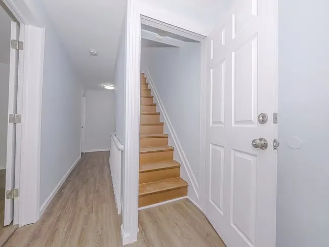 Hallway of 1st floor steps that lead to second floor