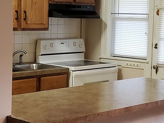 Kitchen has possibilities of bar stools from the dining room.