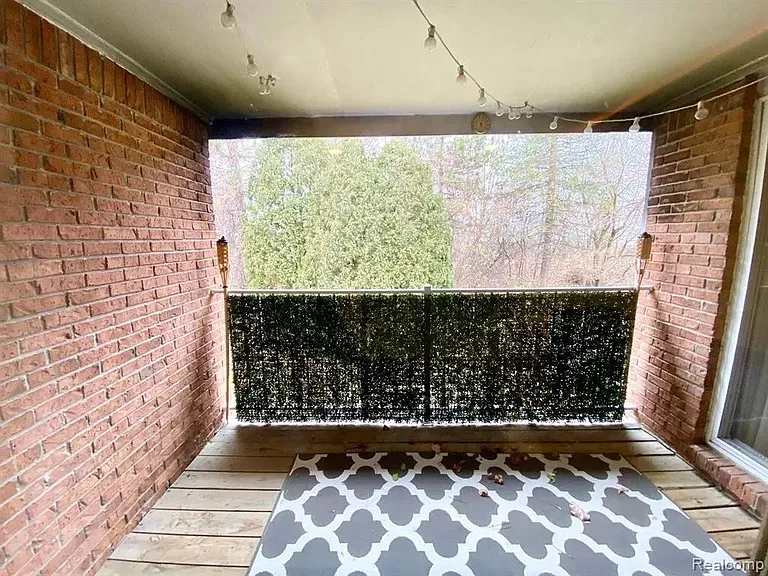 Balcony -- Privacy fencing on railing, string lighting