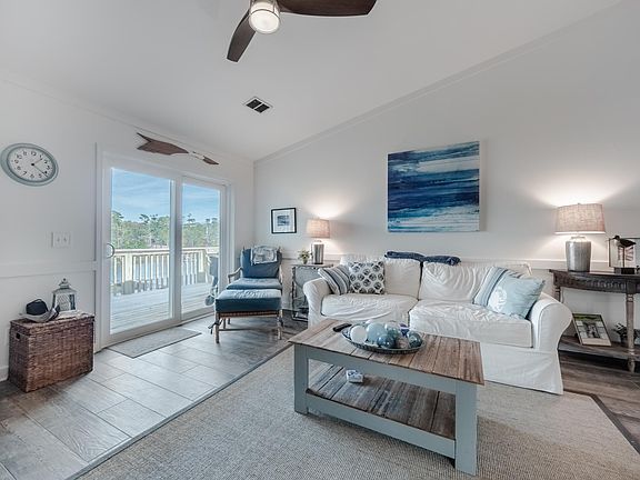 Living room view onto deck and Whiskey Creek