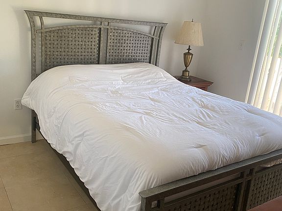 Bedroom 1 Queen Size with access to share balcony with roommate.