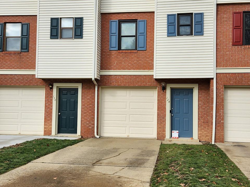 Front door. One-car garage with driveway.