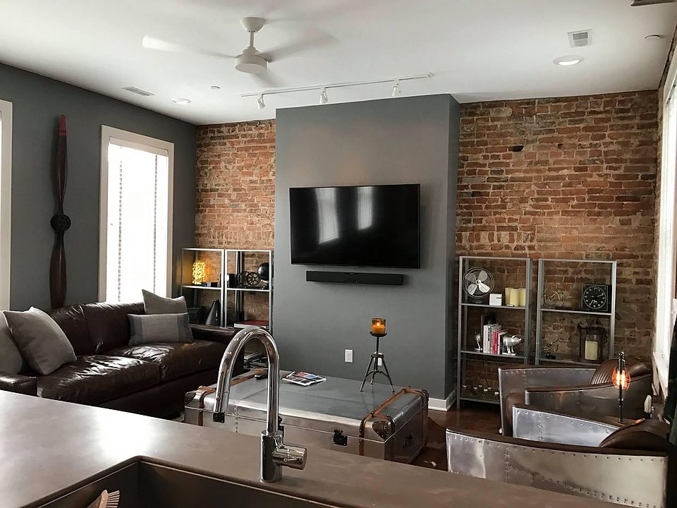 The spacious living area has 5 windows for tons of natural light!