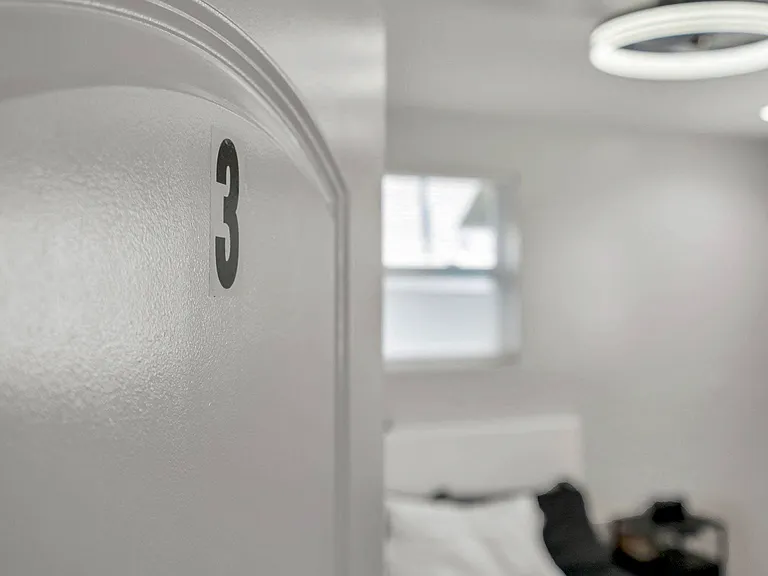 Cozy and newly renovated room with a comfortable bed, modern lighting, and a smart TV for your entertainment.