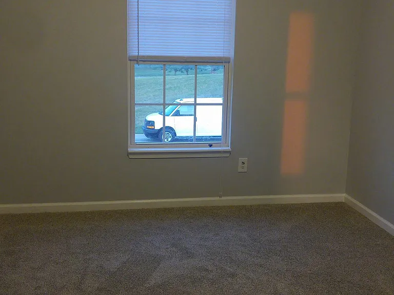BEDROOM 2 & 3 FACE FRONT YARD
