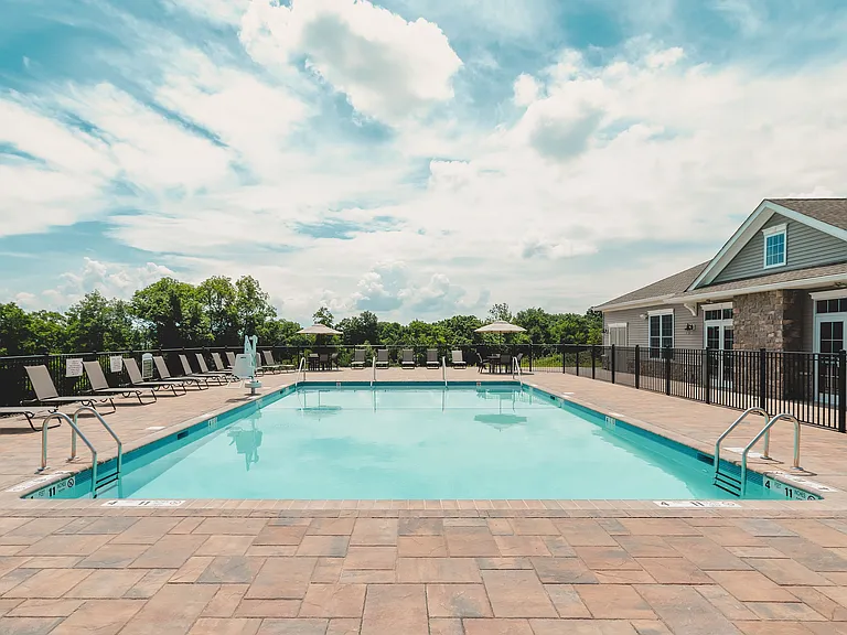Experience relaxation by the heated outdoor pool, perfect for basking in the sun or enjoying a refreshing swim.