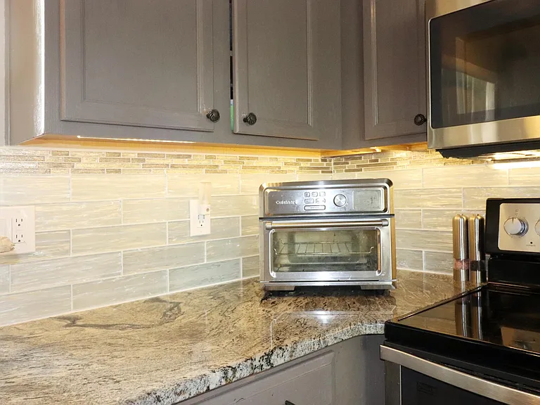 Granite countertop with tile backsplash