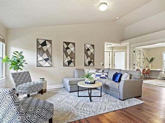 Living room showing bonus room in back