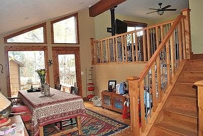 Dining area with vaulted ceiling.