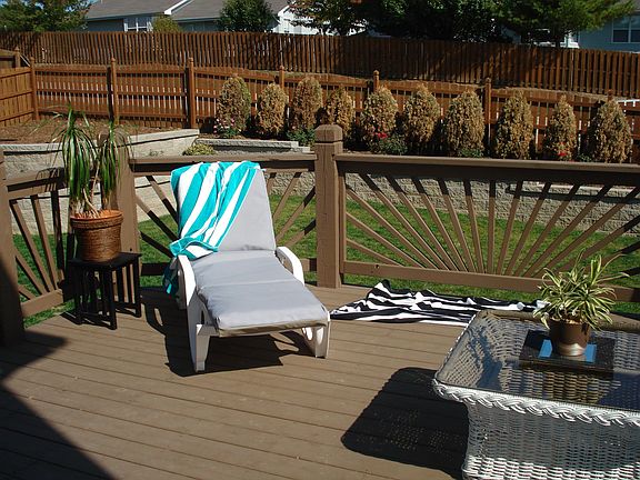 deck overlooking wall and backyard