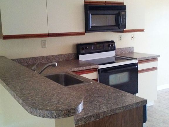 New countertop with breakfast island, microwave hood.