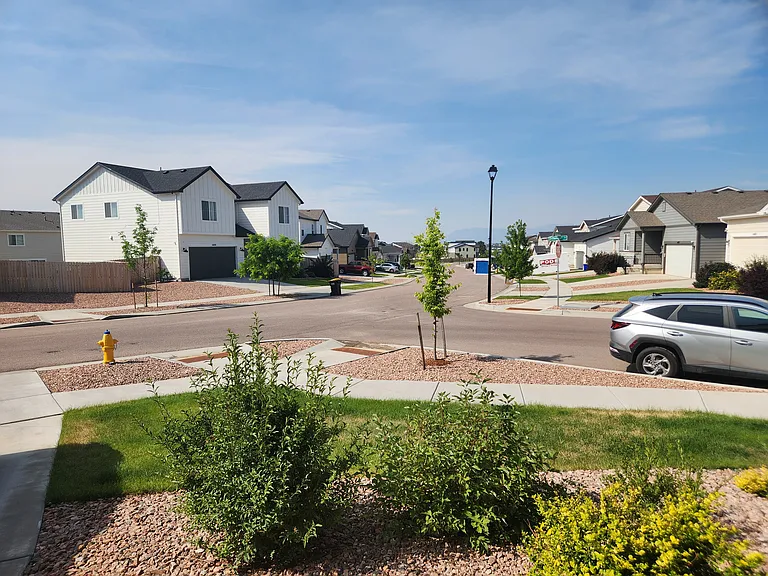 July 2026 view down the street to the south. You usually can see the mountains but there is too much smoke today,