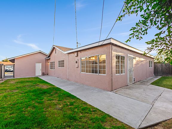 Backyard view showing side gate and back door entrance