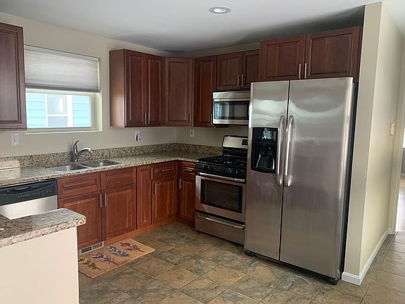 Enter into kitchen area, updated appliances, real tile floors
