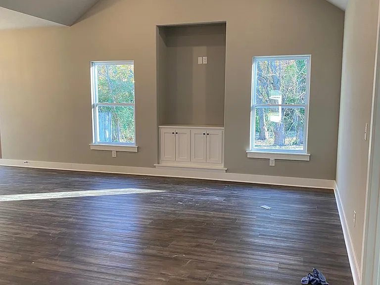 Living Room with vaulted ceiling and ceiling fan
