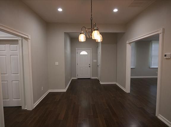 Spacious Dining room; kitchen to left and family room to right.