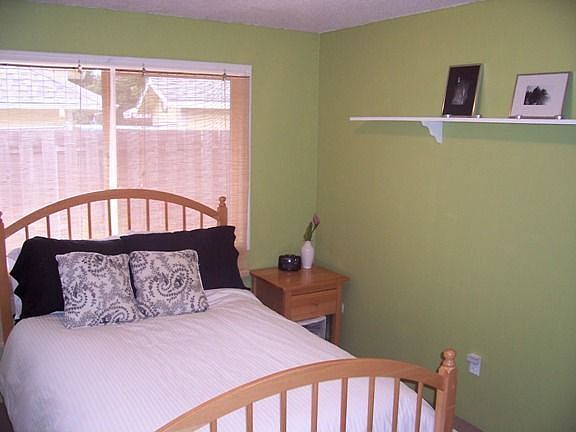 One of three bedrooms with modern colors.