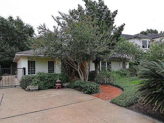 Excellent curb appeal, beautiful lush landscaping, oversized drive and driveway gate are just a few 