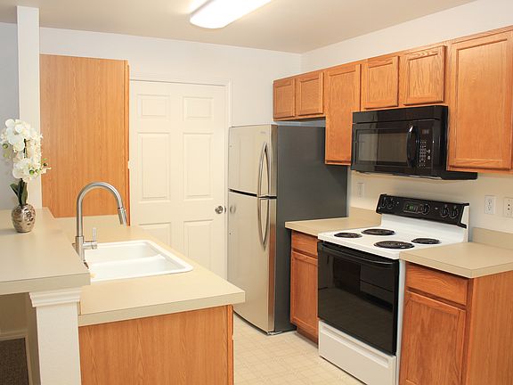 Kitchen with Oversized Refrigerator, Pantry & Entry to Laundry Room