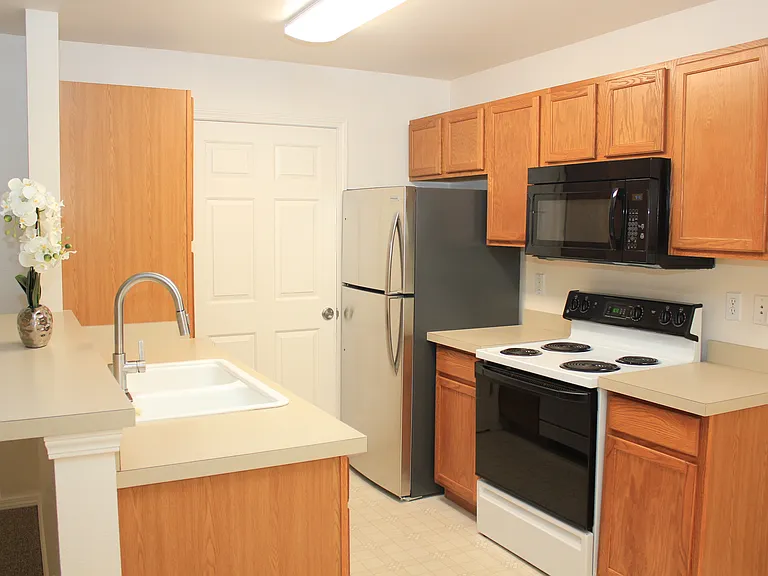 Kitchen with Oversized Refrigerator, Pantry & Entry to Laundry Room