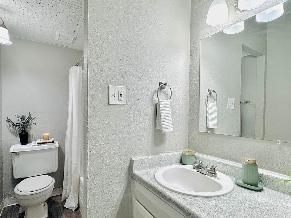 Elegant bathroom featuring modern fixtures, soft lighting, and a stylish vanity, perfect for relaxation.
