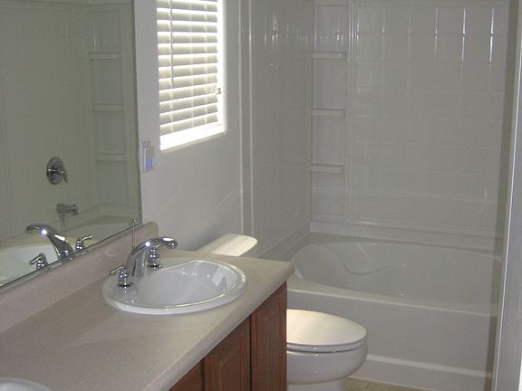 Master bathroom with double sink, walk-in closet
