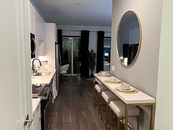 Includes this long table and bar stools to serve as an eating island