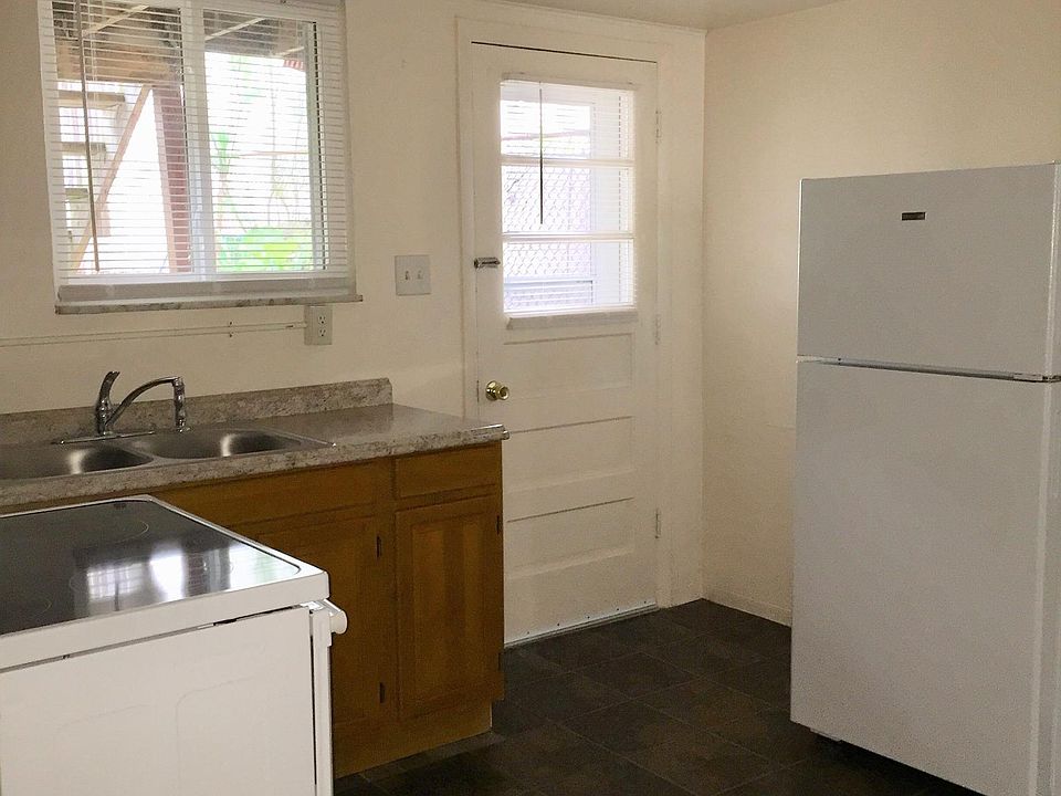 Equipped Kitchen - New Refrigerator and Stove (Also shown in background is rear private entrance.)