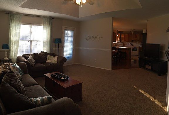 View from the living room into the dining and kitchen.