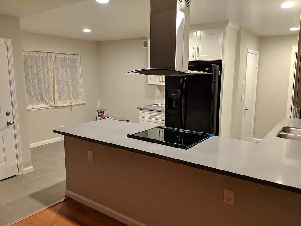 Open concept kitchen with new counters and cabinets
