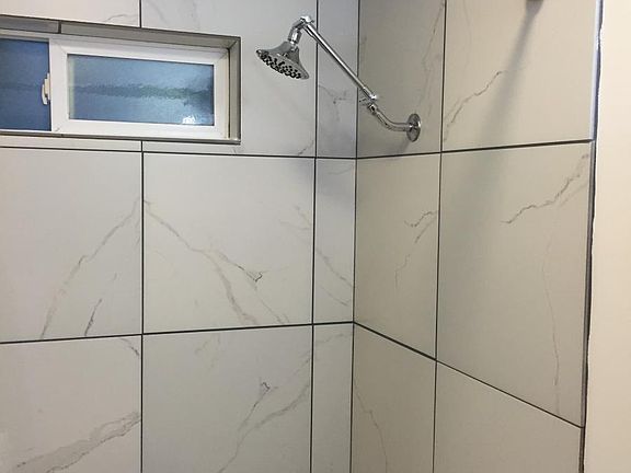 New Tile Bath Tub Surround and Shower.